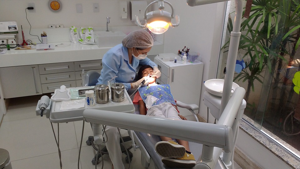 A dentist performing a dental cleaning on a child - Mississauga Dentist - Bristol Dental